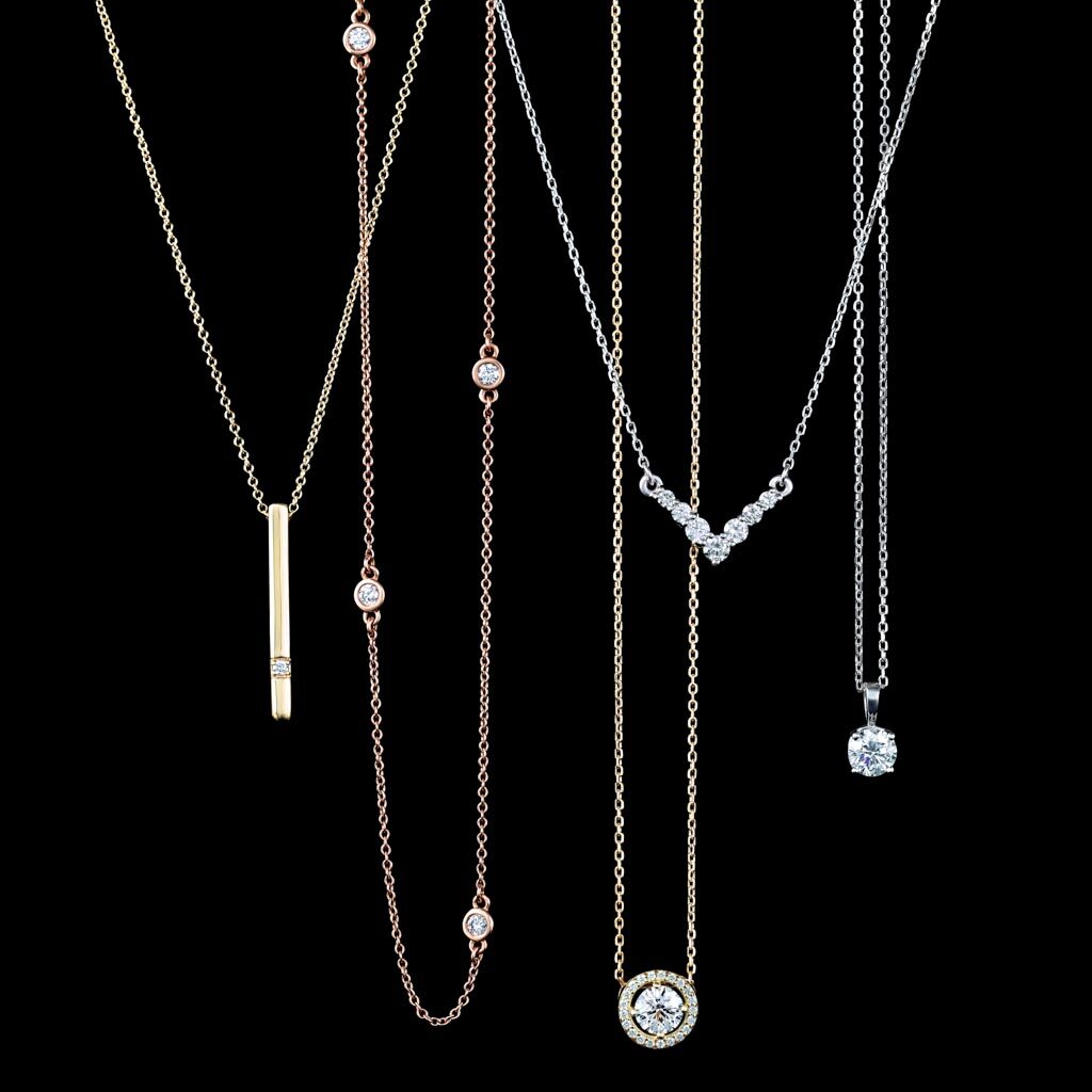 Diamond solitaire, halo, station and bar necklaces